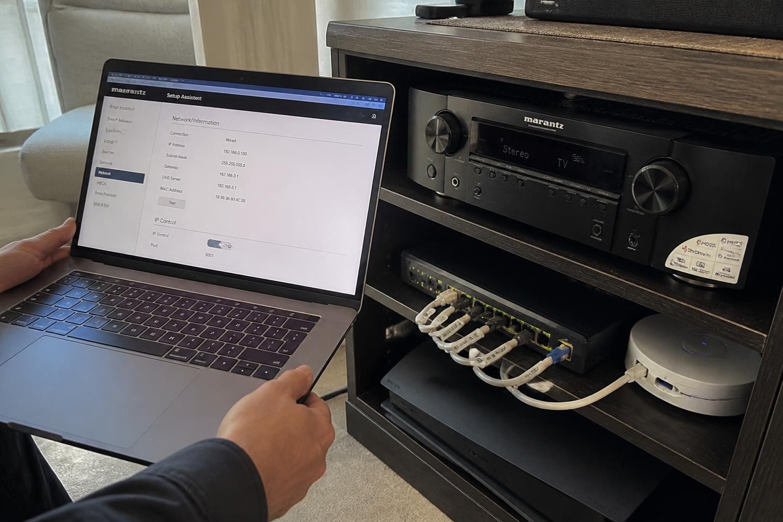 ICSR setting up the AV receiver and network switch once the cabling is done